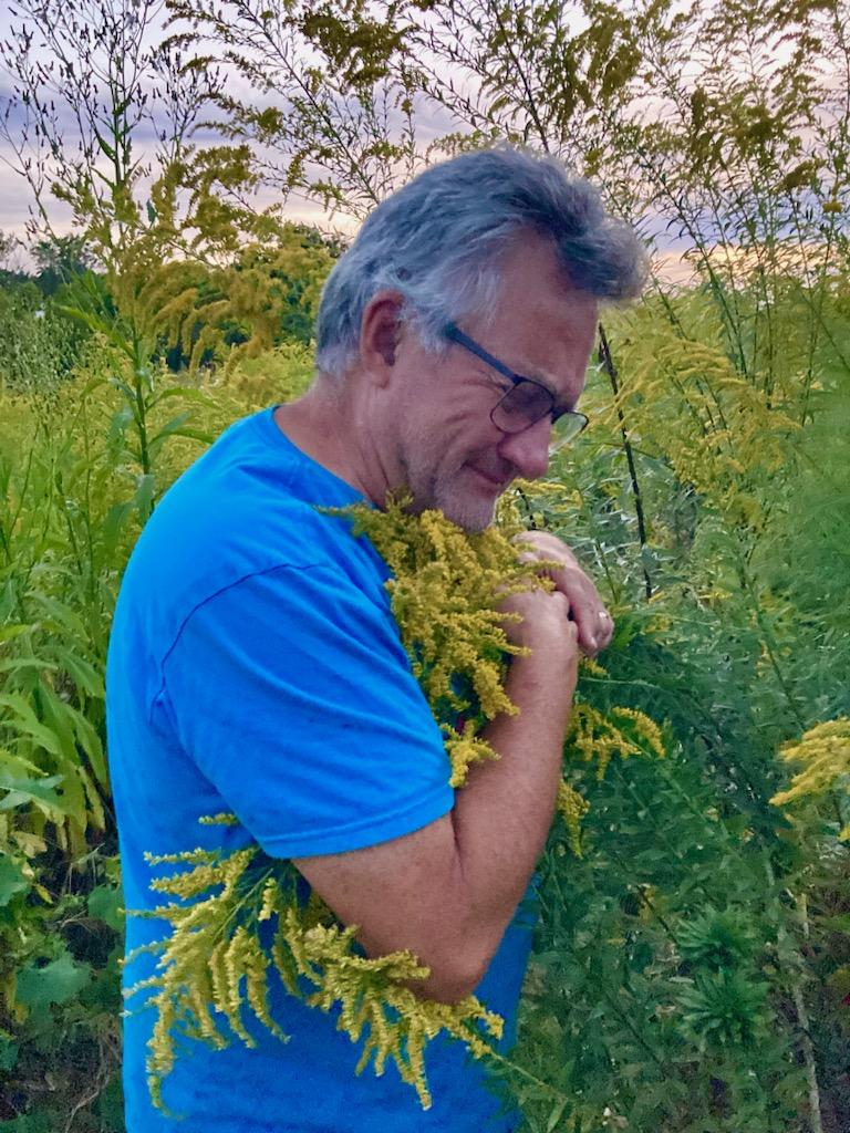 Spirit Tree Farms connecting with Nature -- hugging goldenrod wildflowers