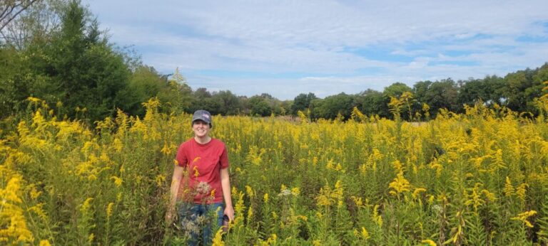 Marnie Pehrson Kuhns in field of Goldenrod at SpiritTreeFarms.com